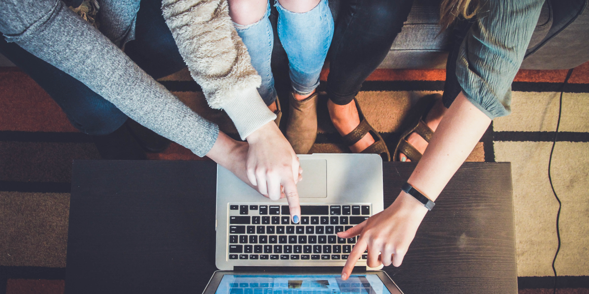 Students in front of a laptop